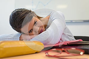 Depressed young woman with computer