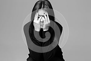 Depressed young woman with hands over her head