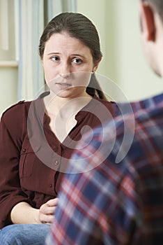 Depressed Young Woman Talking To Counsellor photo