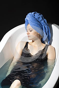 Depression concept. Sad woman in bath. Sadness, fatigue or grief, frustration. Alone upset girl.