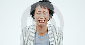 Depression, crying and face of sad woman in studio with anxiety, fear or mental health crisis on white background. Tears