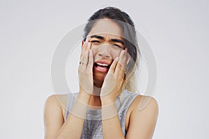 Depression, crying and sad girl in studio with stress, mistake or mental health crisis on white background. Anxiety