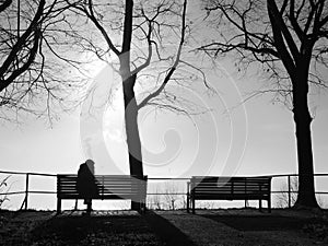 Depression in the fog alone on the park bench