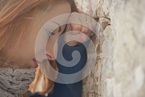 Depression, hopelessness, frustration, anxiety concept. Stressed beautiful woman leaning on the wall