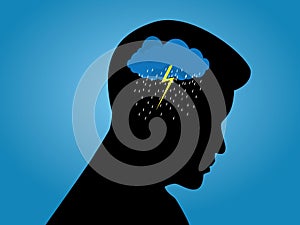 Depression mental health concept. Silhouette of a man with rain cloud in his head