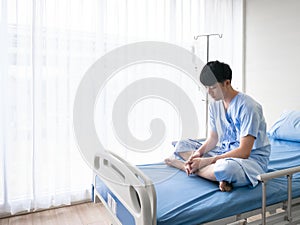 Depression symptoms about absent minded, anxiety disorder and stress from Asian patient alone in hospital bed while waiting