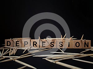 Depression text in dark background. Written on wooden blocks. Mental health concept. Stock photo.