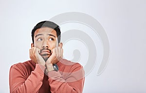 Depression, thinking and sad asian man in studio for stress or broken heart, lonely or bored on grey background. Doubt