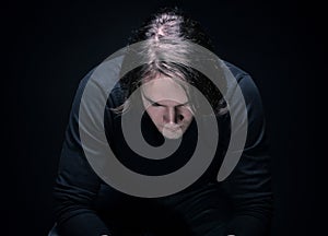 Depressive brunette young man