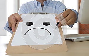 Depressive emotions concept, smiley face emoticon printed depr