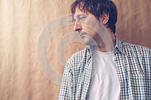 Depressive sad man profile portrait