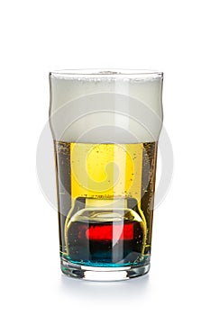 Depth charge cocktail of beer, blue Curacao liqueur, grenadine and vodka, prepared by mixing a submerged inverted Cup at