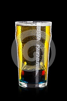Depth charge cocktail of beer, liqueur and vodka, prepared by mixing a submerged inverted Cup at the bottom of a beer