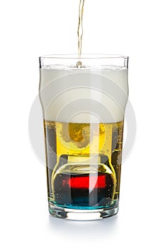 Depth charge cocktail of beer, liqueur and vodka, prepared by mixing a submerged inverted Cup at the bottom of a beer