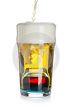 Depth charge cocktail of beer, liqueur and vodka, prepared by mixing a submerged inverted Cup at the bottom of a beer