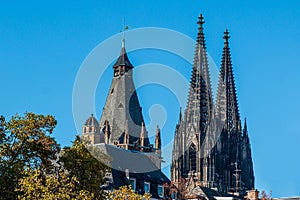 The towers of Cologne Cathedral and the historic town hall in the old town photo
