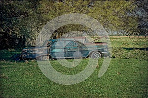 Derelict Abandoned Antique Cars in Open Meadow