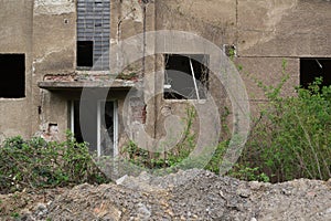 Derelict and abandoned ruin of damaged, destructed and desolated building