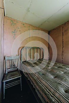 Derelict Bedroom with Bed + Chair - Abandoned Cottage - Catskill Mountains, New York