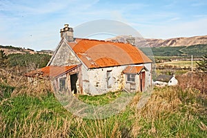 Derelict cottage with iron roof