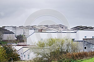 Derelict council house development in poor housing crisis ghetto estate slum in England