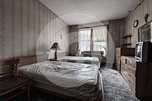 Derelict Furnished Bedroom with Beds, Cabinets & Television - Abandoned Edgemont Nursing Home - Pennsylvania