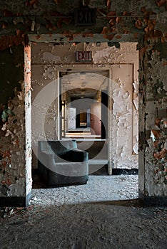 Derelict Hallway with Rubber Chair - Abandoned Central Islip State Hospital - New York