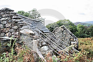 A Derelict stone building with a broken roof