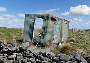 Derelict toilet block in Pennine landscape