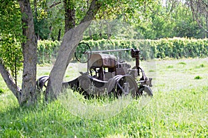 Derelict tractor in field