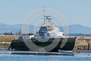 Derelict Vessel resting on blocks on Steamboat Slough