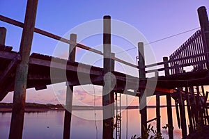 Derelict wharves on Pioneer River at Mackay at sunrise