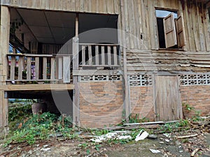 A derelict wooden house at a Thai temple