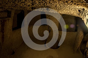 Derinkuyu underground city detail. Impressive fairy chimneys of sandstone in the canyon near Cavusin village, Cappadocia