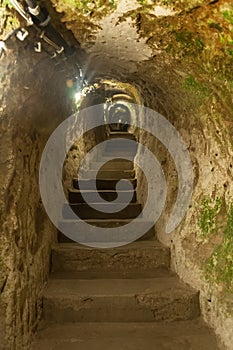 Derinkuyu underground city detail. Impressive fairy chimneys of sandstone in the canyon near Cavusin village, Cappadocia