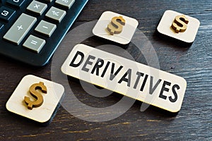 Derivatives word on the plate near calculator.