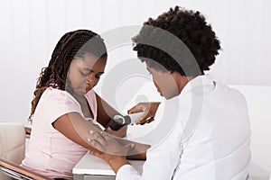 Dermatologist Checking The Child Patient Skin