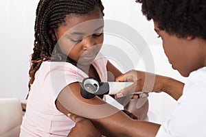 Dermatologist Checking The Child Patient Skin