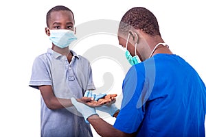 A dermatologist doctor examining the hands of a little boy