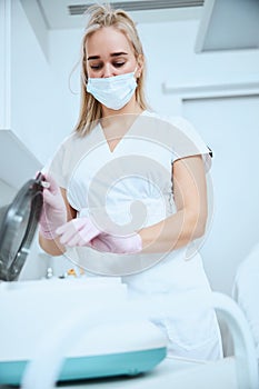 Dermatologist preparing the serum for a treatment procedure