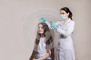 A dermatologist or trichologist applies a dandruff or lice weed to the patient& x27;s hair. Treating psoriasis, hair loss