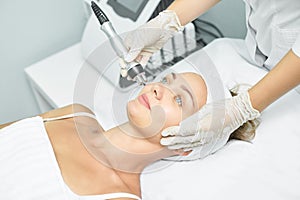 Dermatology skin care facial therapy. Medical spa anto wrinkles procedure. Woman face rejuvenation. Pretty girl. Rf cosmetician