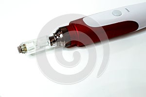 Dermis stamp electric pen. Dermapen. Needle mesotherapy treatment. photo