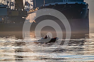 Derry, Londonderry, United Kingdom - December 19 2021: Staff working on the river foyle harbour in Northern Ireland