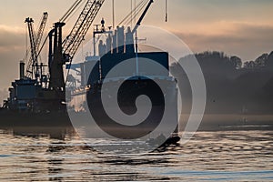 Derry, Londonderry, United Kingdom - December 19 2021: Staff working on the river foyle harbour in Northern Ireland