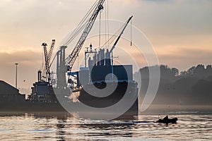 Derry, Londonderry, United Kingdom - December 19 2021: Staff working on the river foyle harbour in Northern Ireland