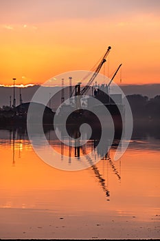 Derry, Londonderry, United Kingdom - December 19 2021: Staff working on the river foyle harbour in Northern Ireland