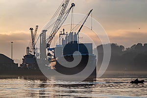 Derry, Londonderry, United Kingdom - December 19 2021: Staff working on the river foyle harbour in Northern Ireland