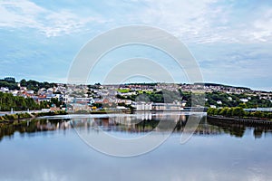 Derry, North Ireland. Aerial view of Derry Londonderry city center in Northern Ireland, UK. Sunny day with cloudy sky