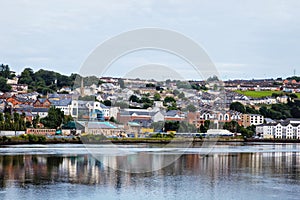 Derry, North Ireland. Aerial view of Derry Londonderry city center in Northern Ireland, UK. Sunny day with cloudy sky, city walls